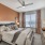 Large well lit bedroom with plush carpets and large windows 