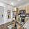 Spacious and well lit kitchen with wood flooring and stainless steel appliances