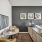 Spacious and well lit living room with wood flooring, large windows and open access to the kitchen