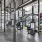 Large fitness center with large windows and plenty of equipment