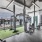 Large fitness center with large windows and plenty of equipment