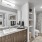 Large well lit bathroom with white accents 