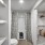 Large well lit bathroom with white accents 
