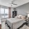 Large well lit bedroom with plush carpets and large windows 